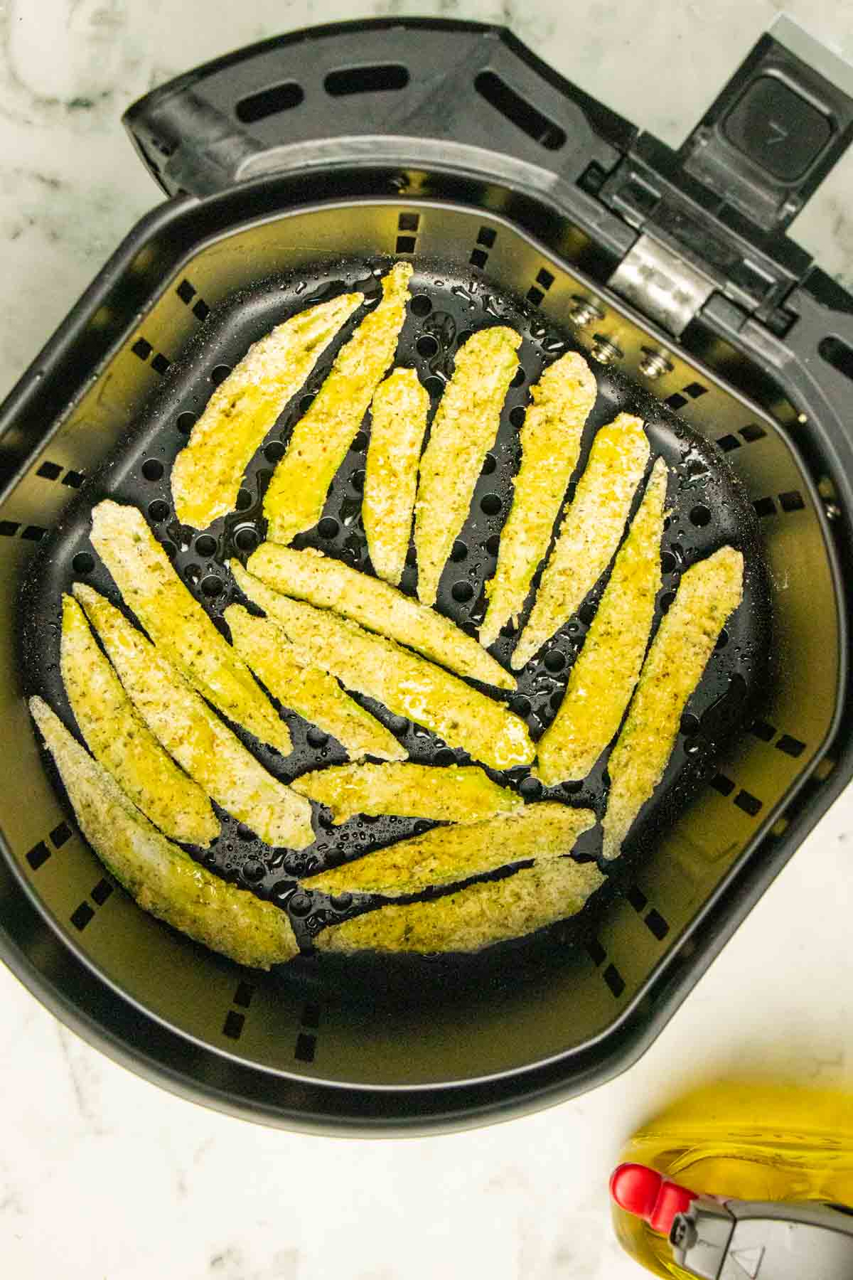okra in air fryer basket before cooking
