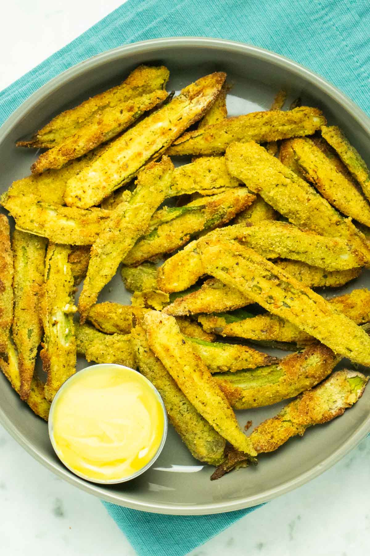 serving platter of air fryer okra with creamy dipping sauce