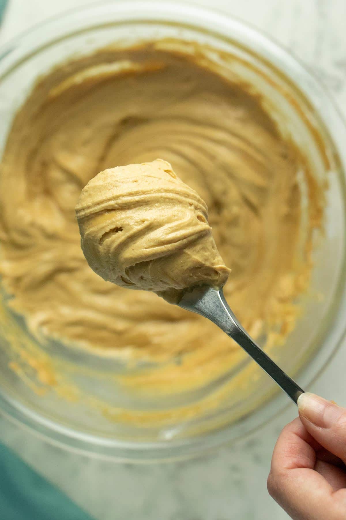 fluffy vegan peanut butter frosting on a fork