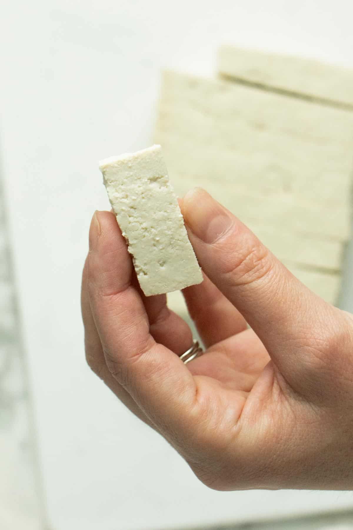 close-up of a tofu piece, so you can see the size and shape