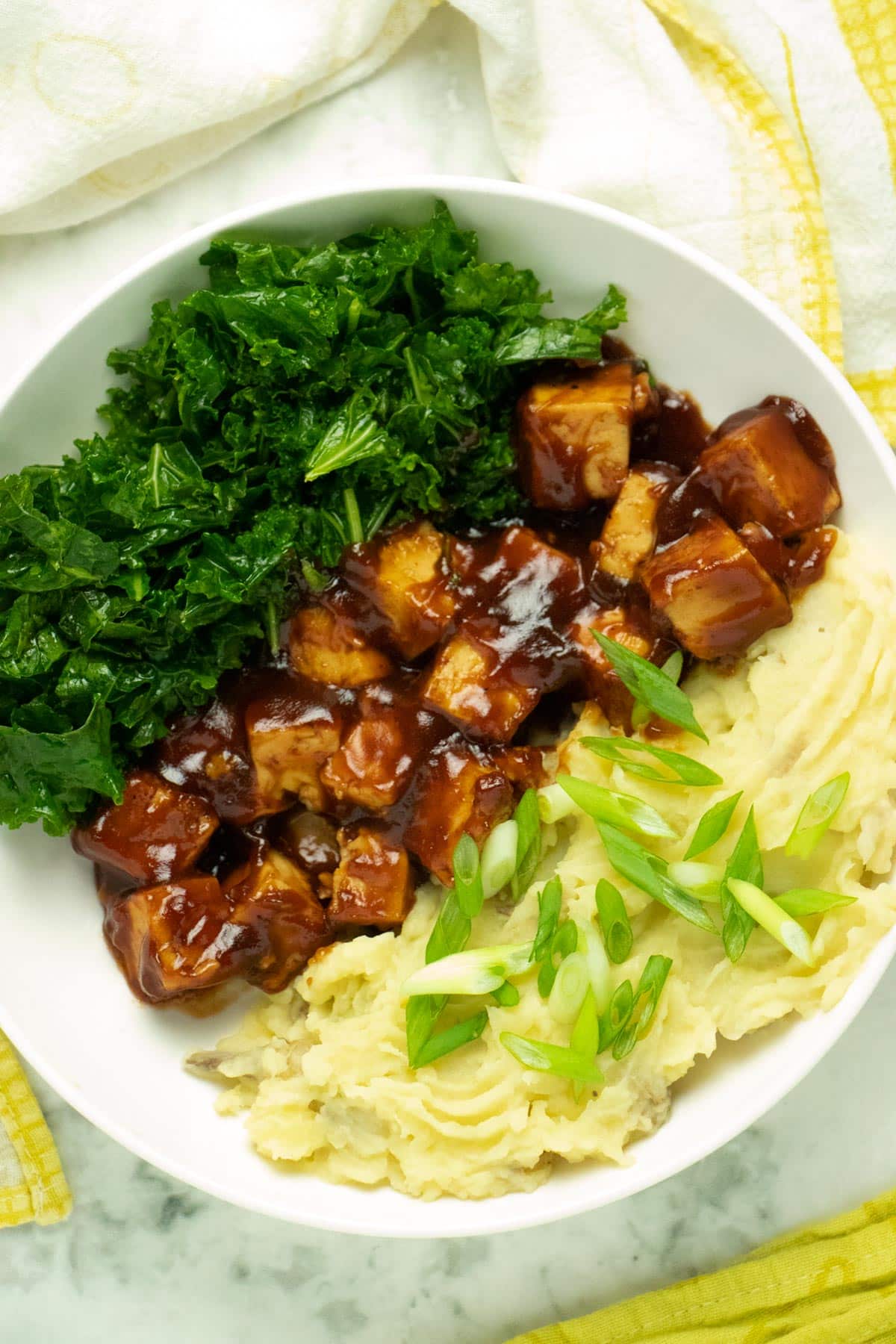 bbq tofu bowl with mashed potatoes and kale