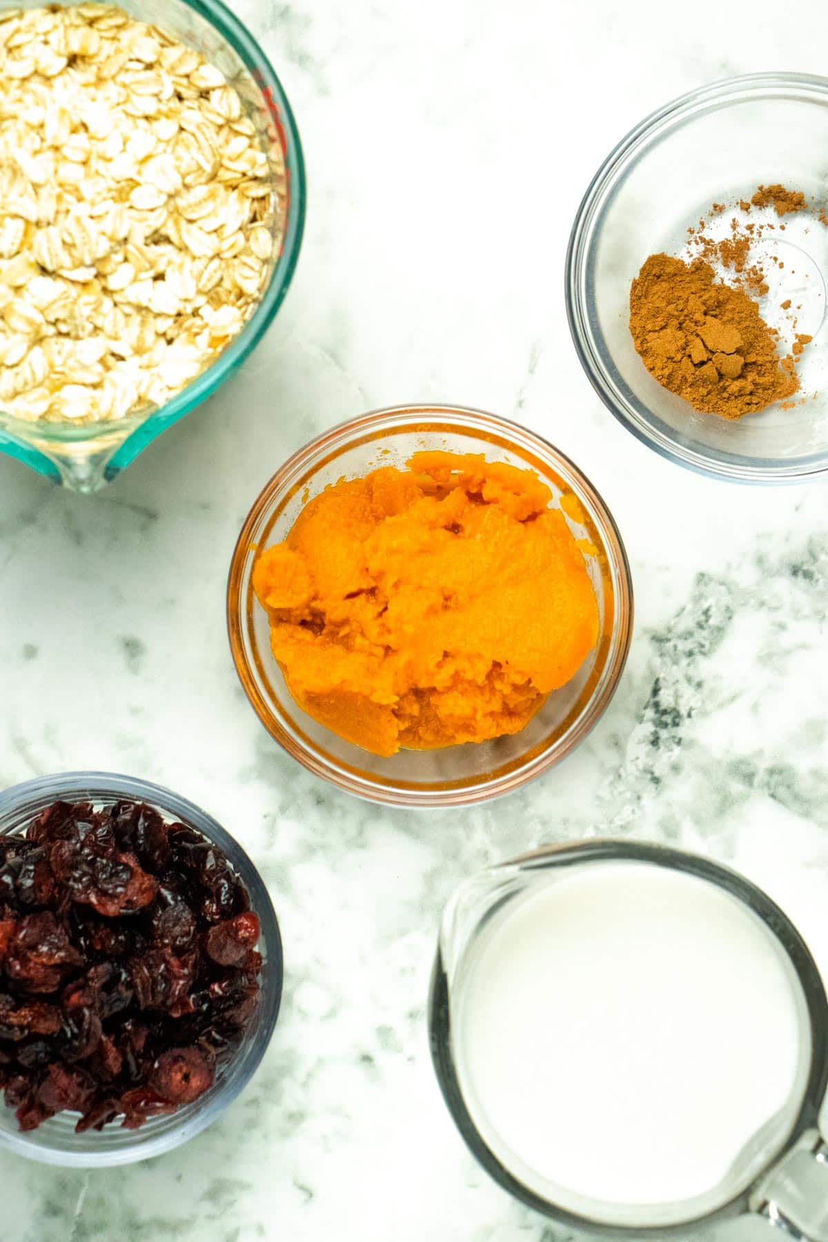 pumpkin spice oatmeal ingredients on a marble table