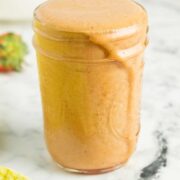 mason jar of creamy strawberry basil dressing