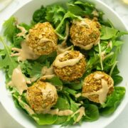 green salad topped with air fryer falafel