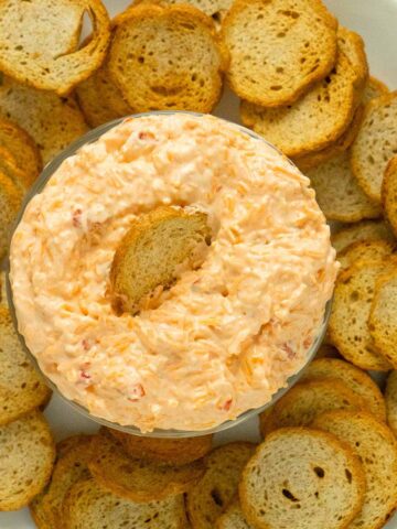 serving bowl of vegan pimento cheese with crackers