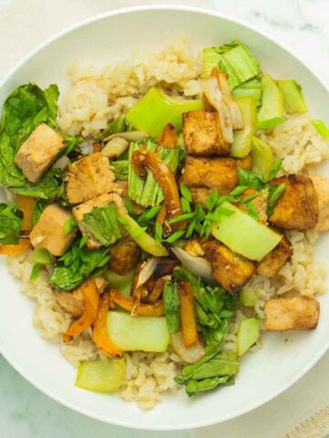 air fryer stir fry on a white plate with rice