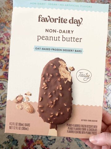 hand holding a bow of Favorite Day Non-Dairy Peanut Butter Ice Cream Bars