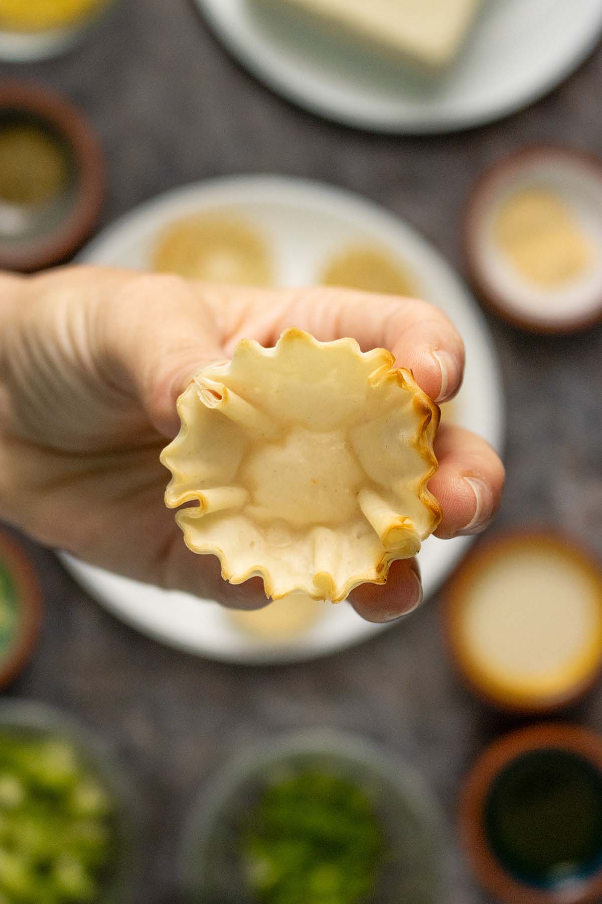 hand holding a vegan phyllo cup