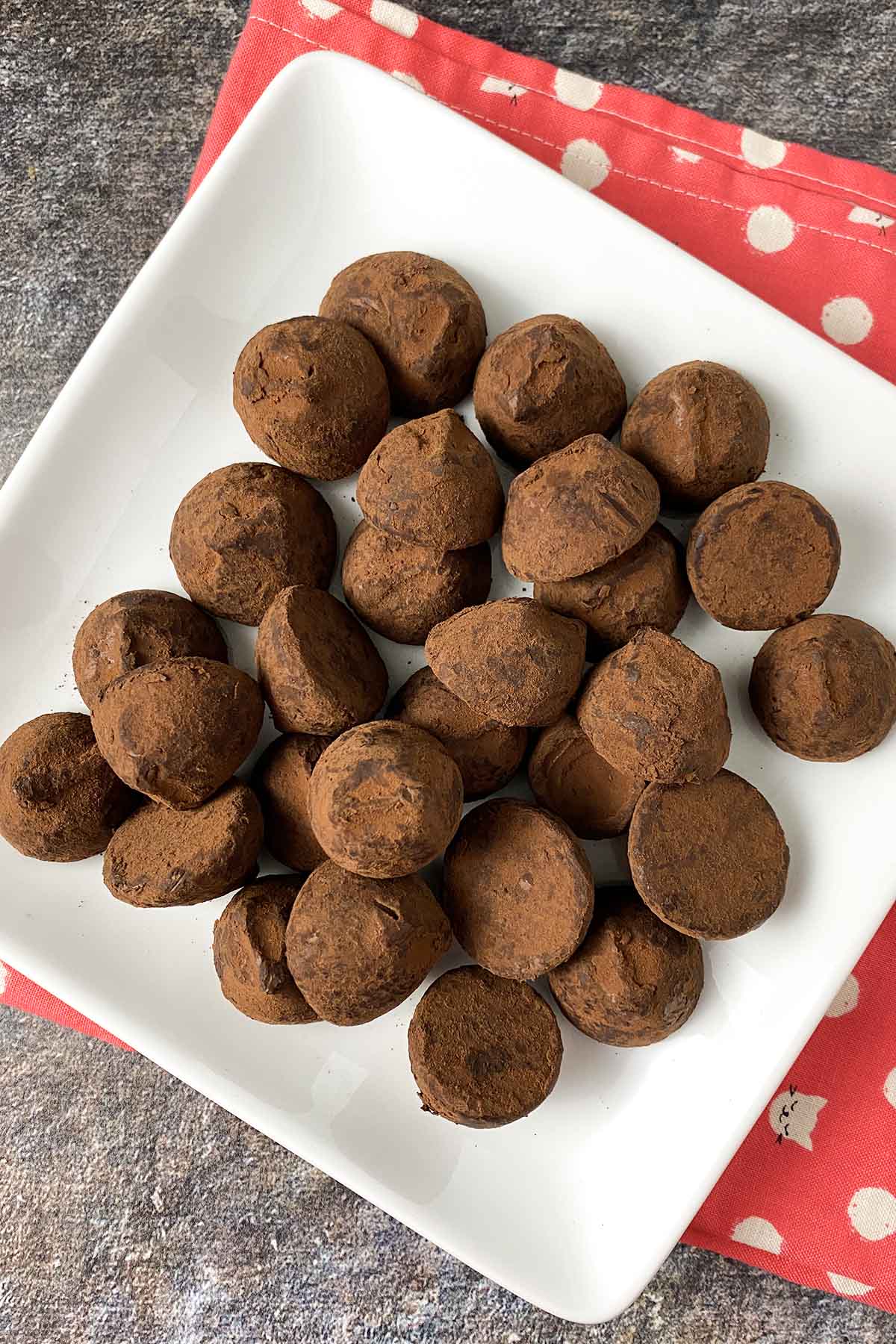 vegan chocolate truffles on a white, square plate