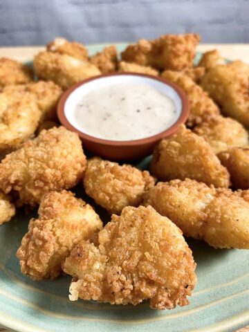 plate of Wholly Veggie! Ranch Cauliflower Wings on a plate with the ranch as a dipping sauce