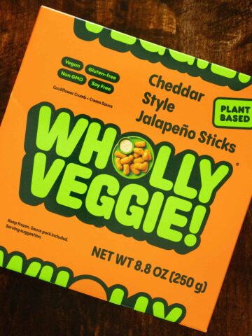 Wholly Veggie Cheddar Jalapeno Sticks box on a wooden table