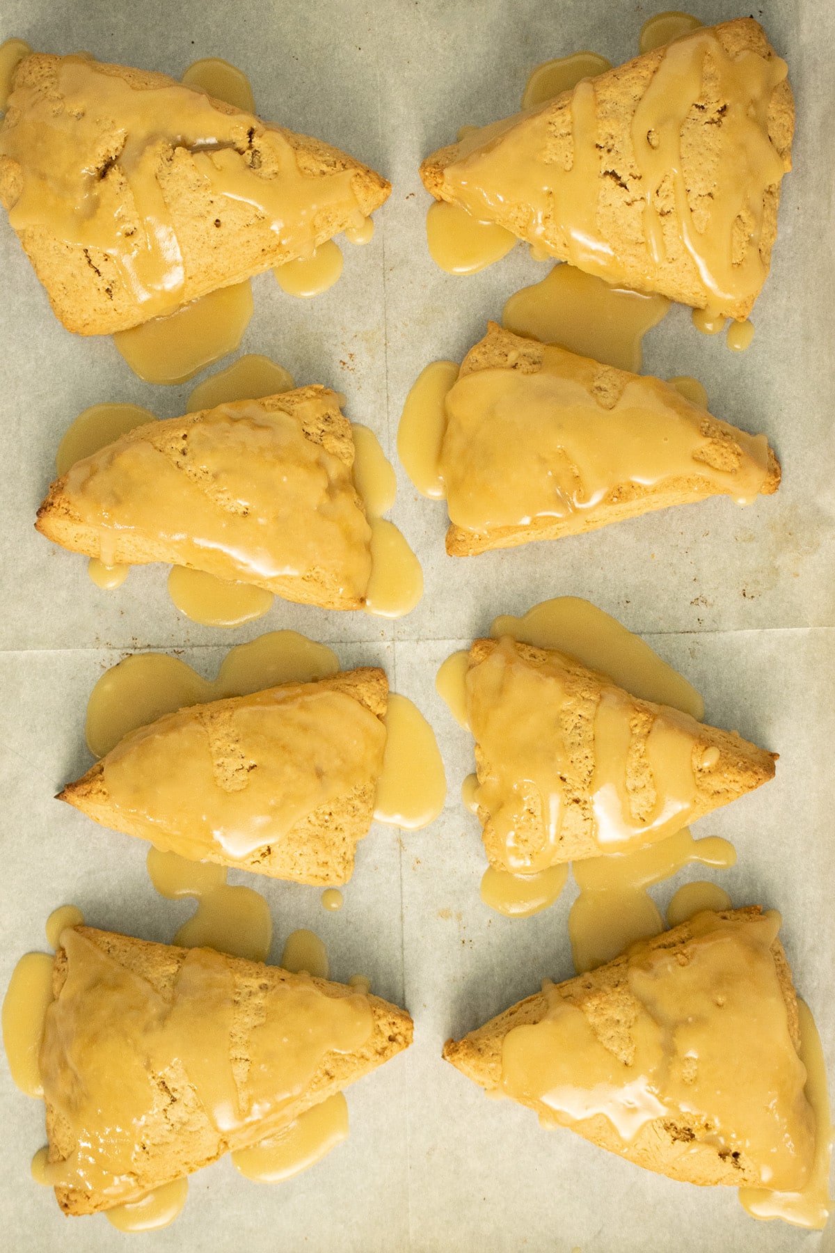 glazed scones on a baking sheet