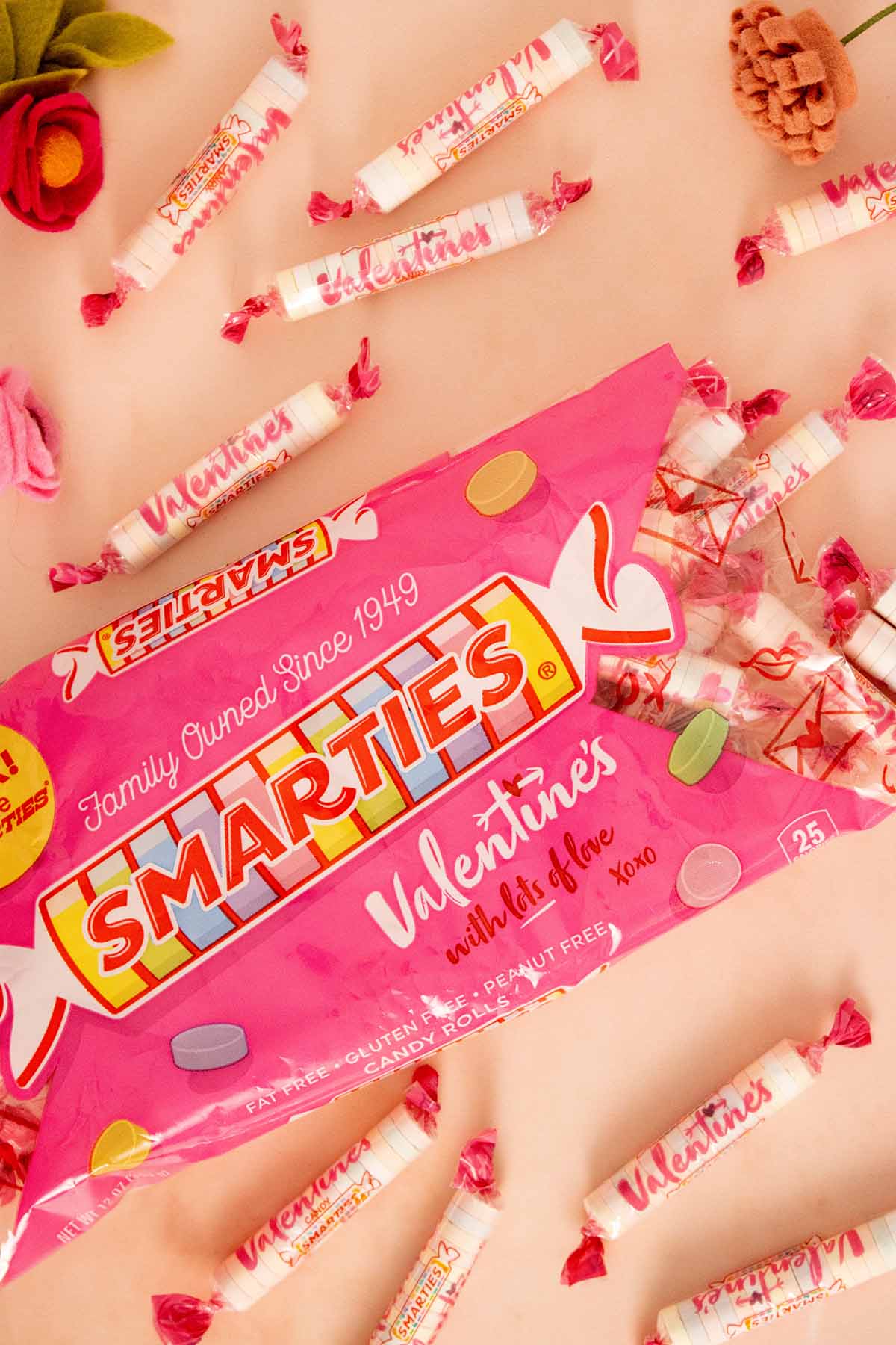 open bag of Smarties Valentine's with candy spilling out