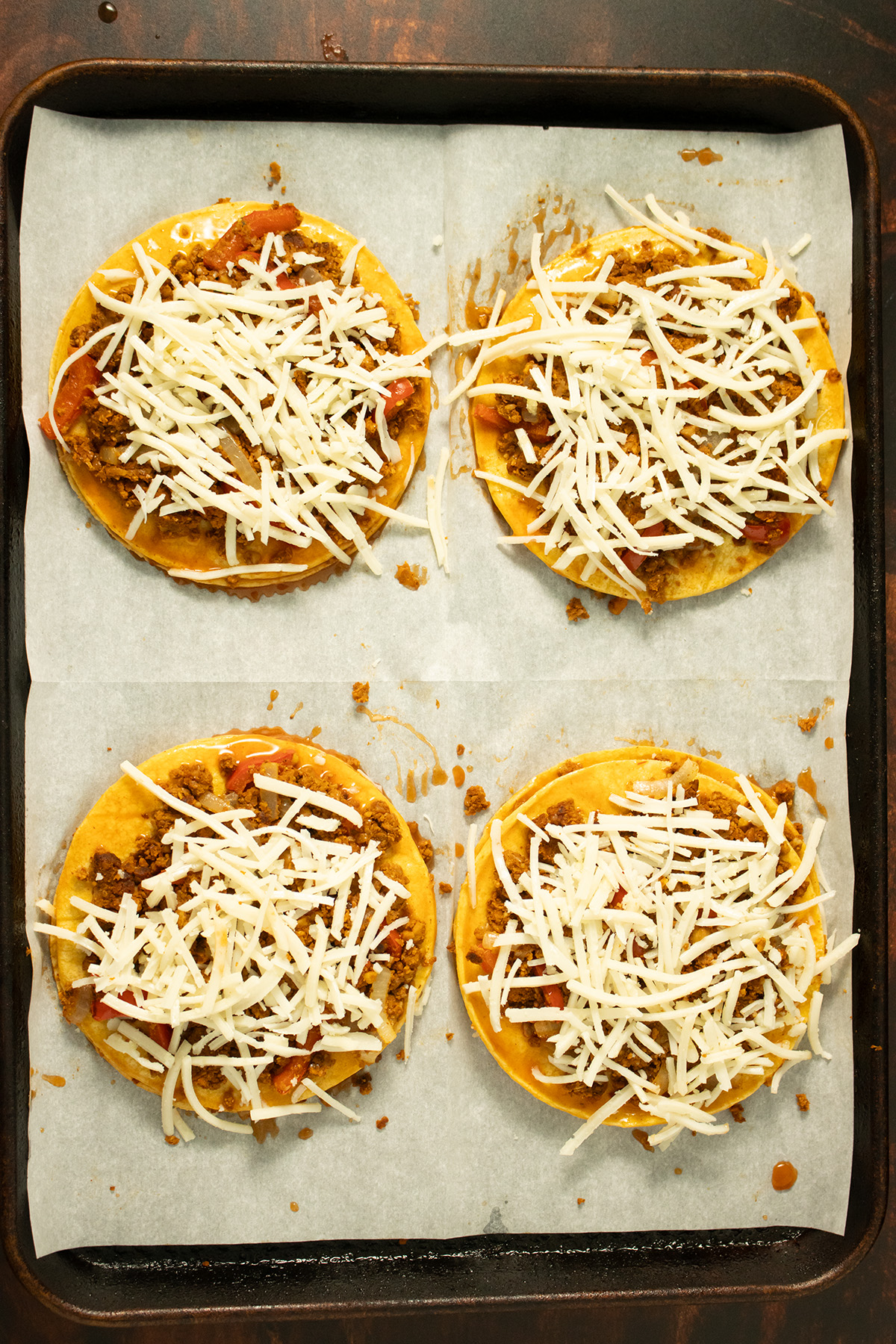 adding cheese on top of the chorizo