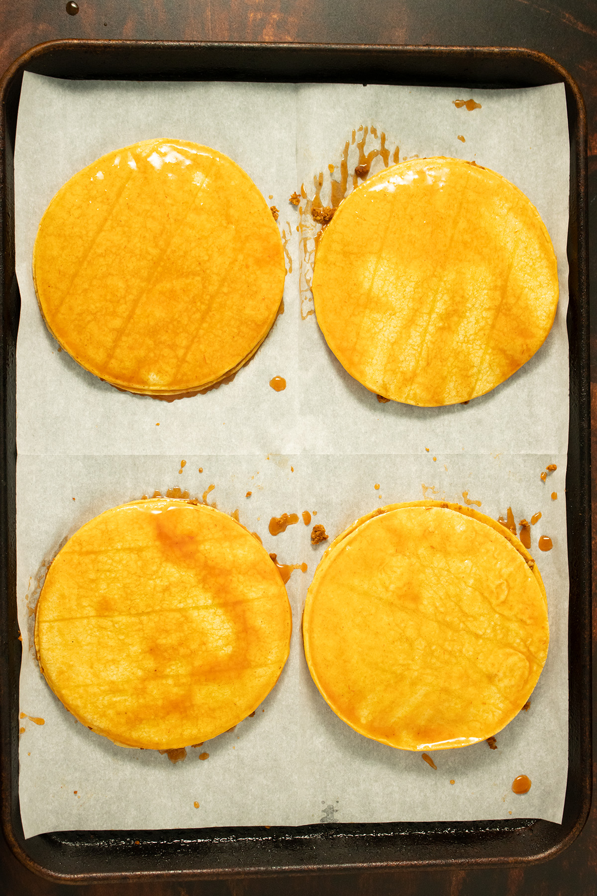 adding another coated tortilla on top of the chorizo