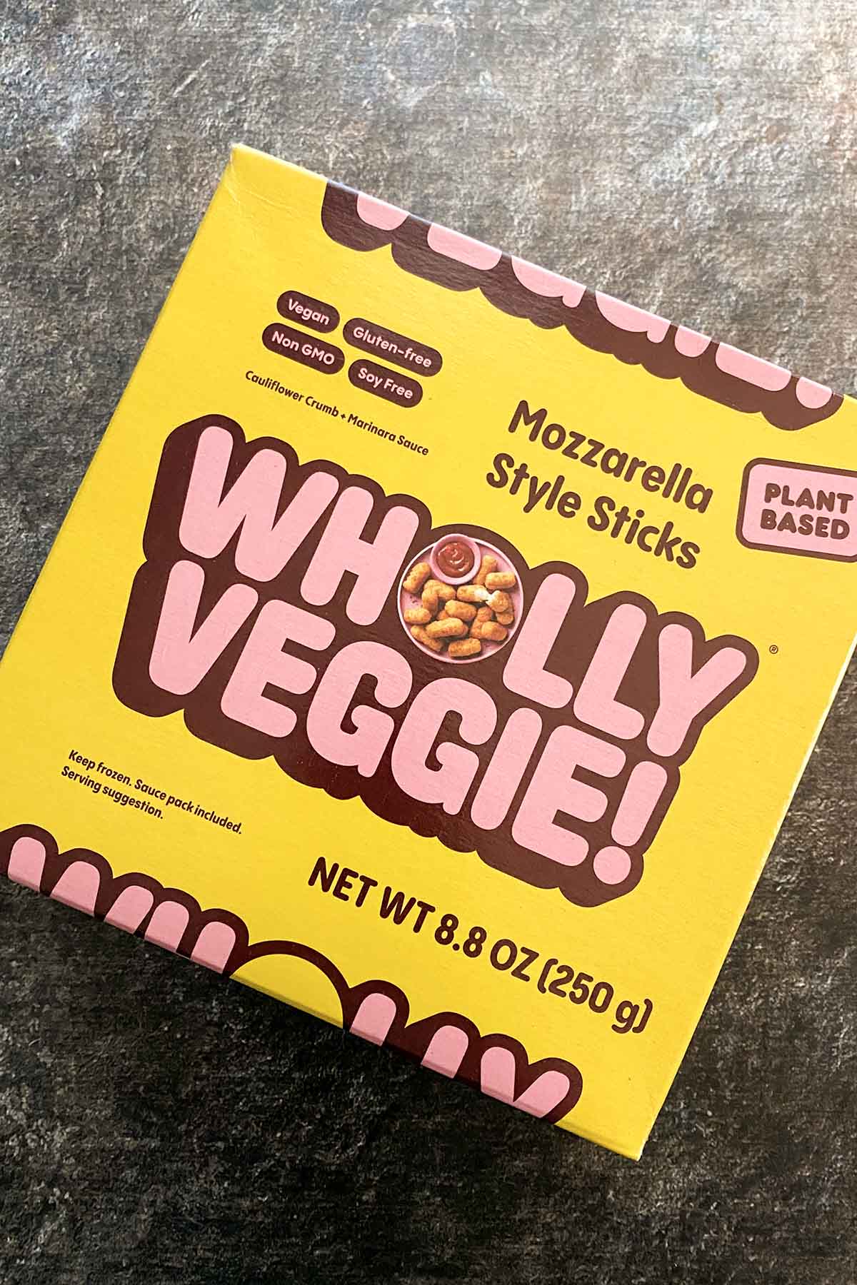 package of Wholly Veggie! Mozzarella Sticks on a slate countertop