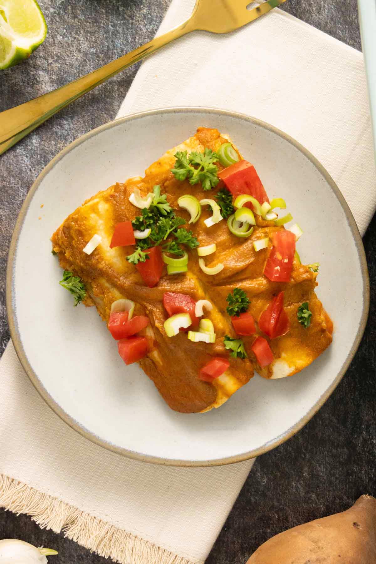 black bean sweet potato enchiladas on a plate