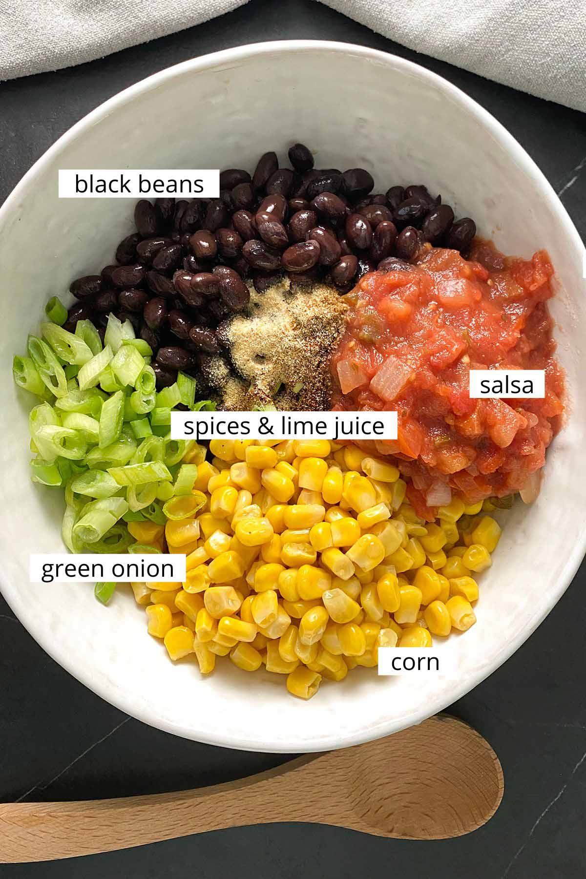 bean salad ingredients in a bowl before mixing