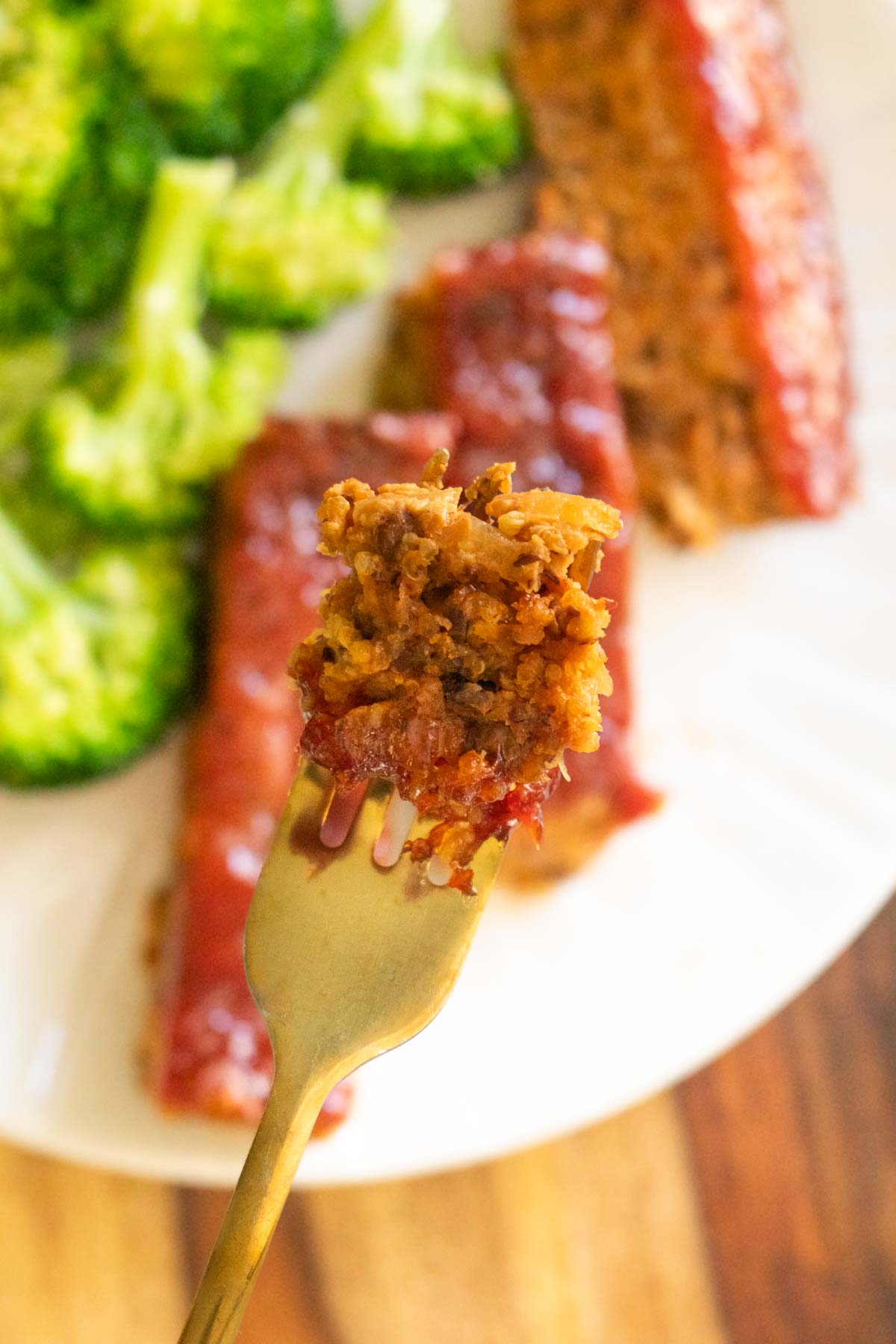 close-up of a bite of quinoa lentil loaf on a fork