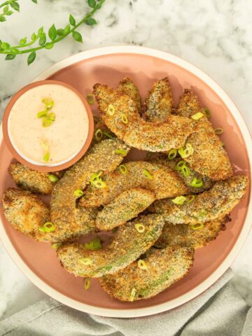 avocado fries on a plate next to sriracha mayo dipping sauce