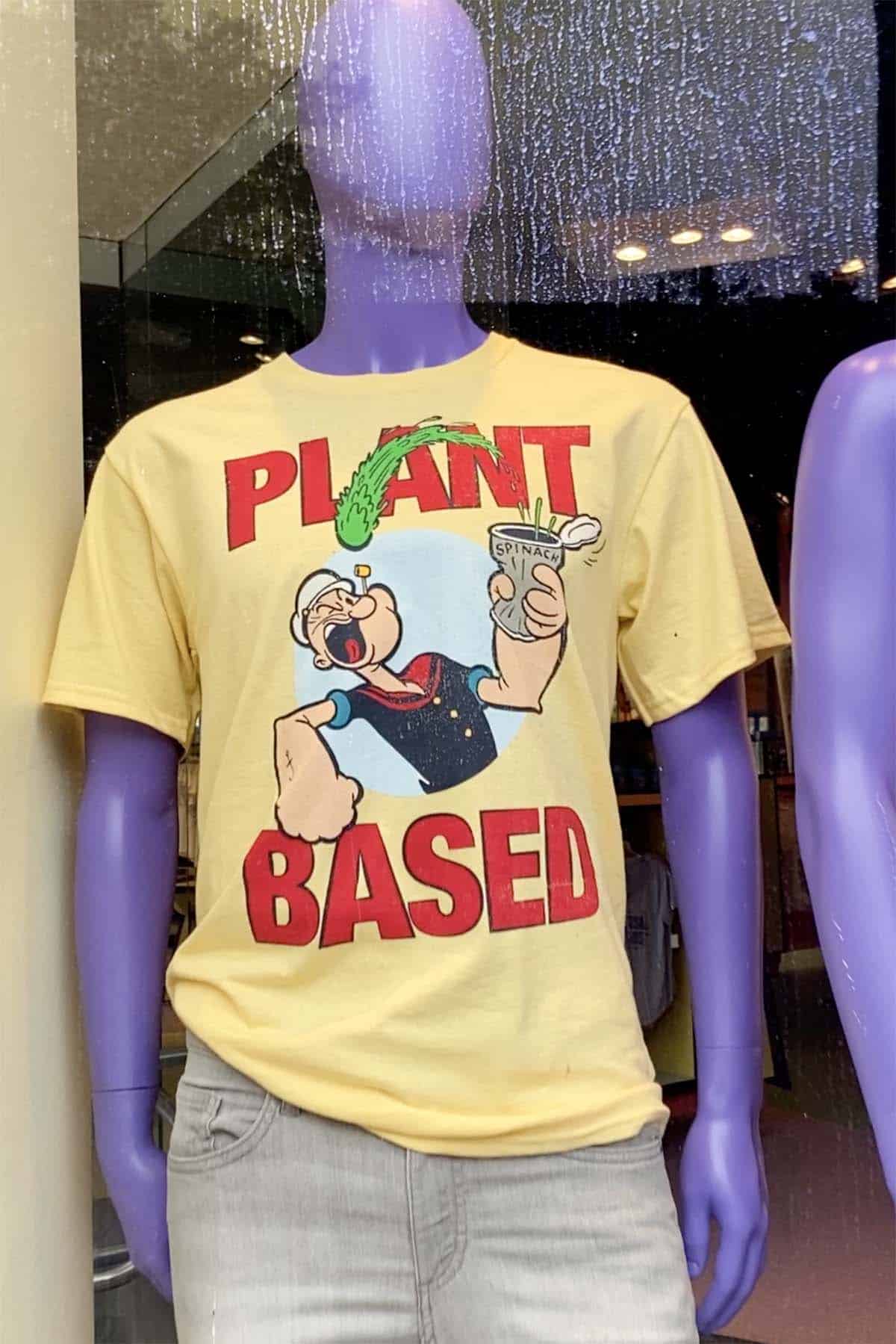 mannequin wearing a Popeye shirt that ways Plant Based