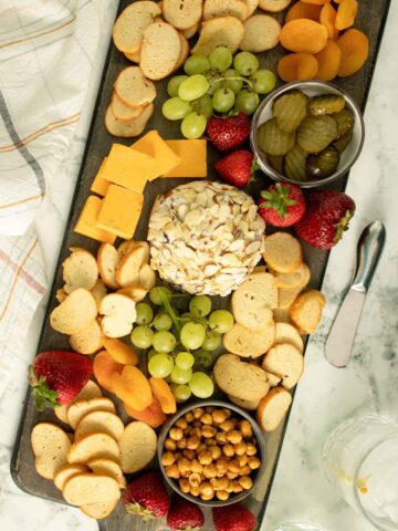 vegan cheese board on a marble table