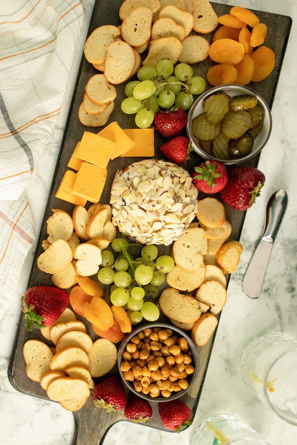 vegan cheese board on a marble table