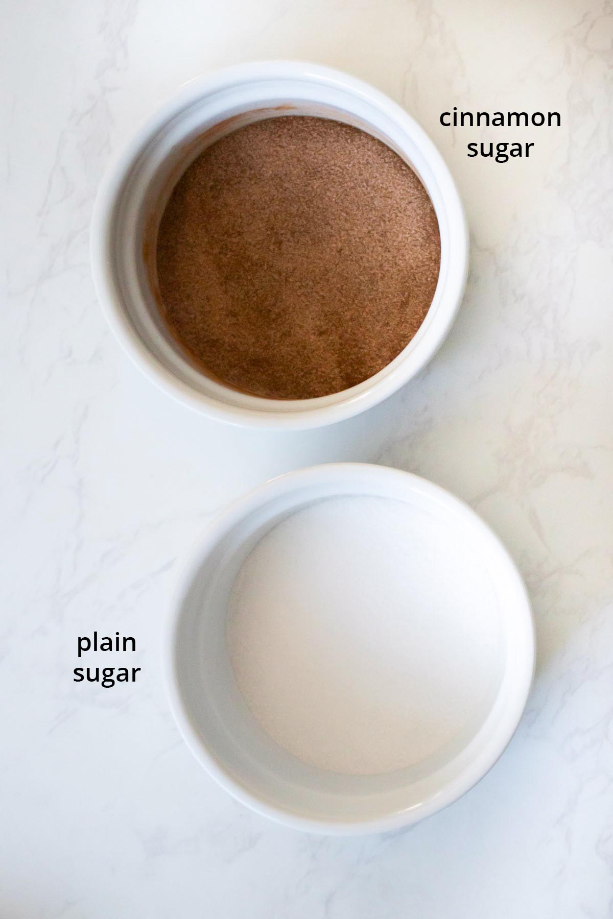 cinnamon sugar and plain sugar for coating the air fryer donut holes