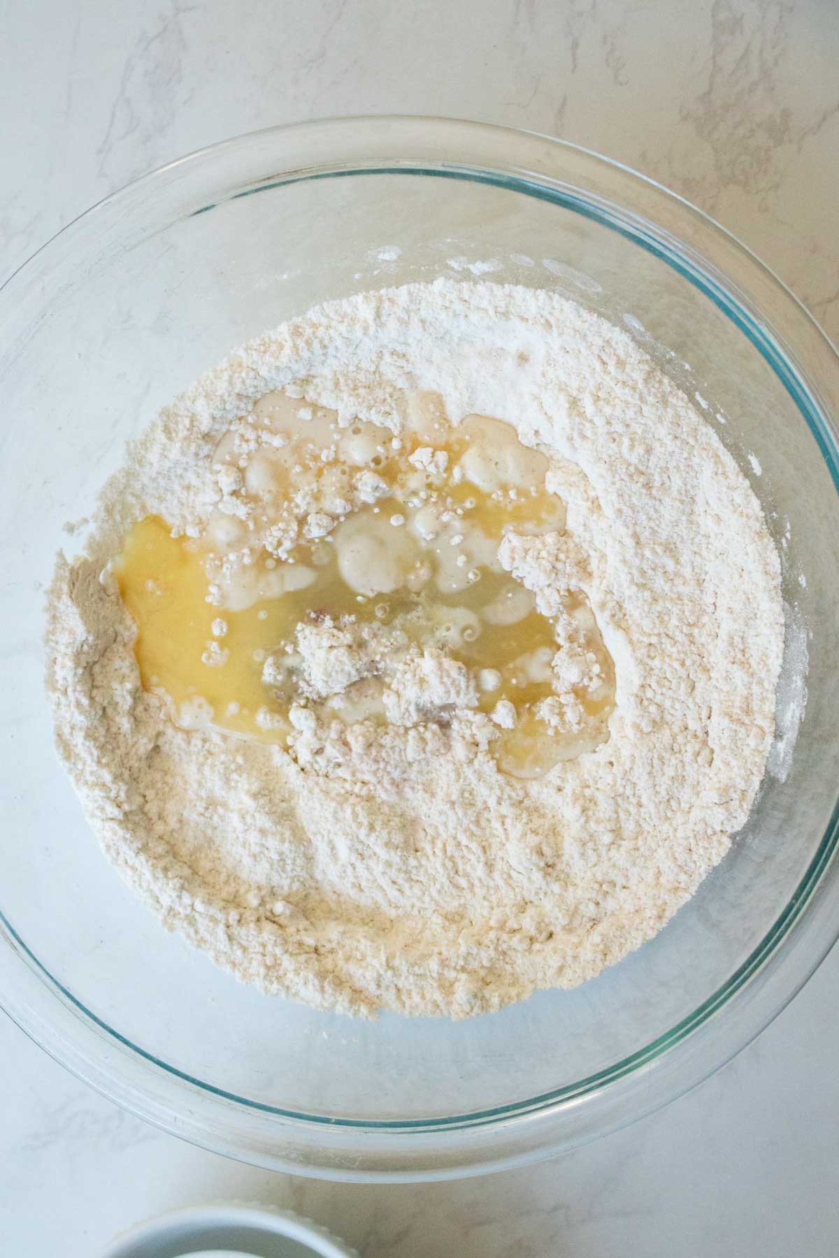 adding wet ingredients to the dry