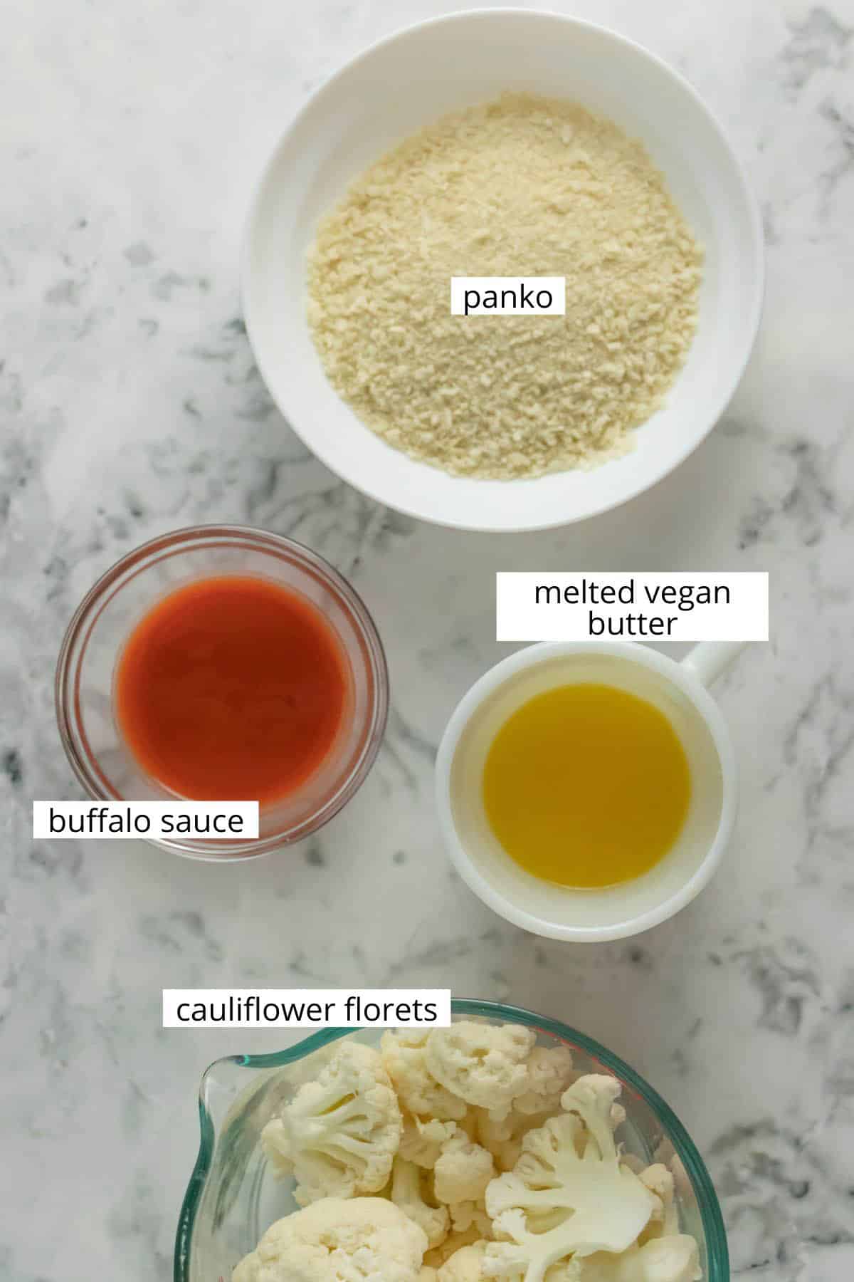 image collage of panko, buffalo sauce, vegan butter, and cauliflower in bowls on a table with text labels