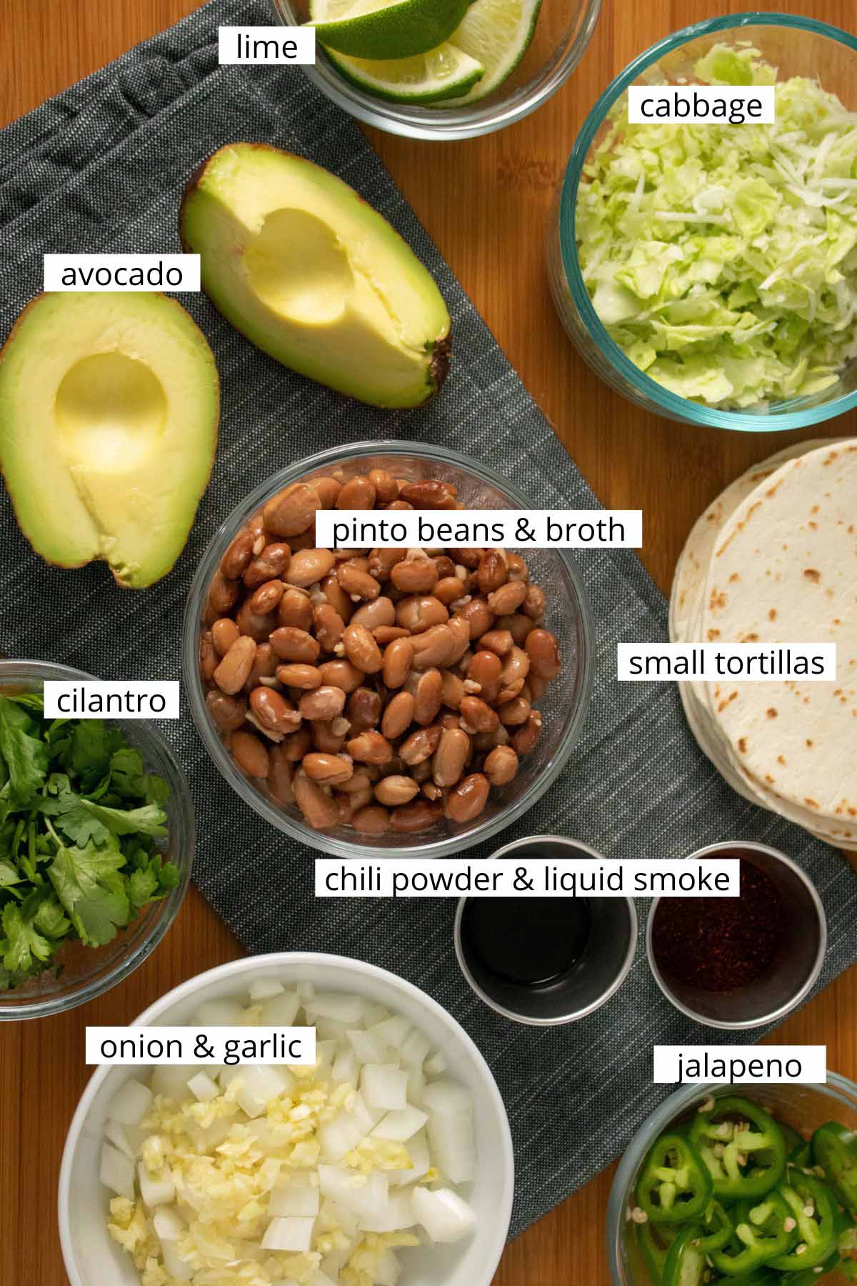 image collage of pinto beans & broth with other taco ingredients on a wooden table with text labels on each ingredient