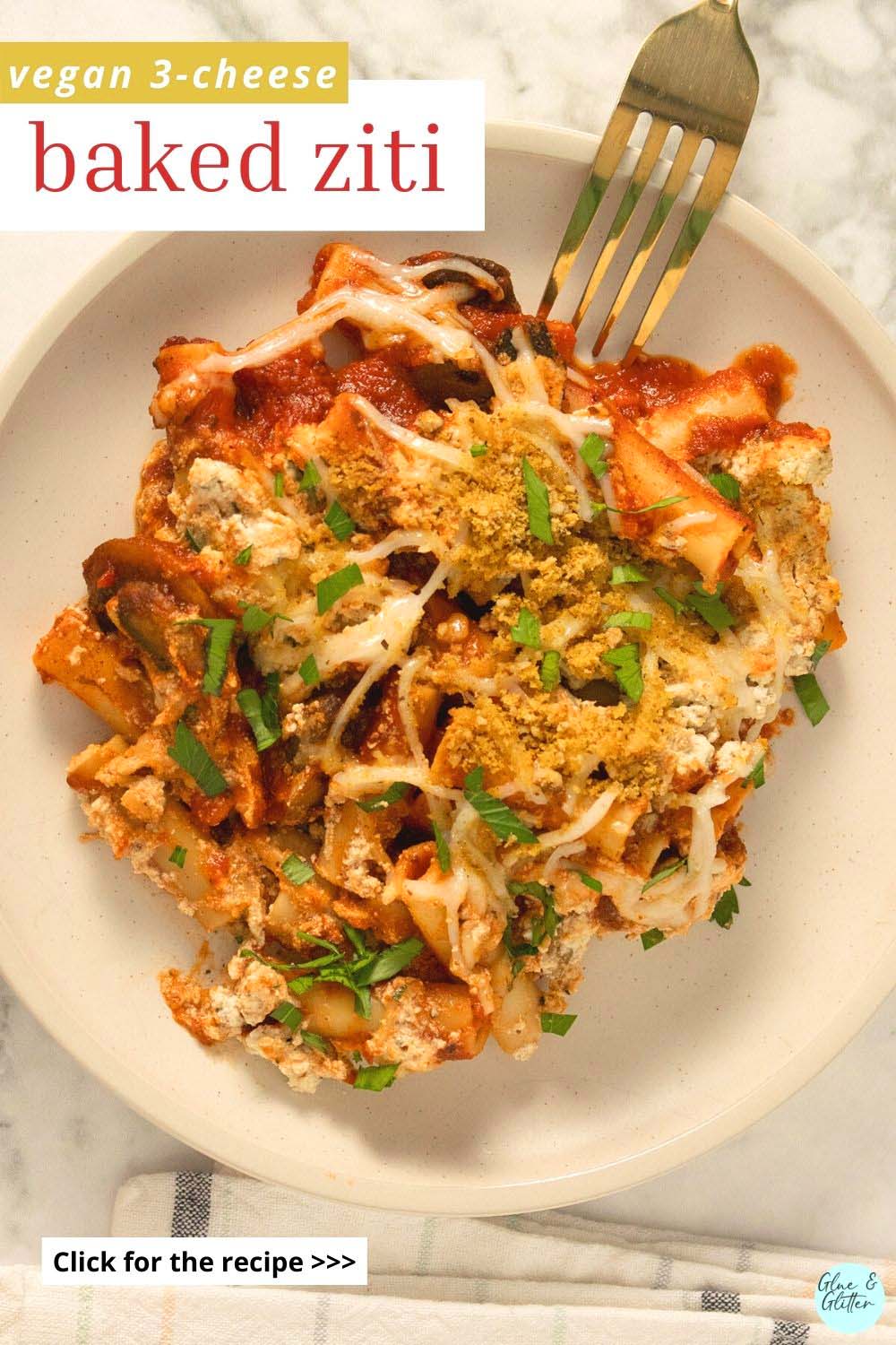 vegan baked ziti on a plate with a fork, text overlay