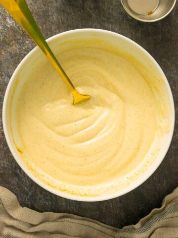 curry mayonnaise after mixing in a bowl with the fork