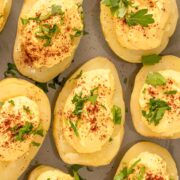 serving tray of deviled potatoes topped with paprika and parsley