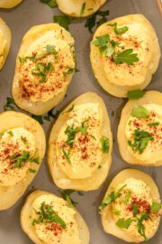 serving tray of deviled potatoes topped with paprika and parsley