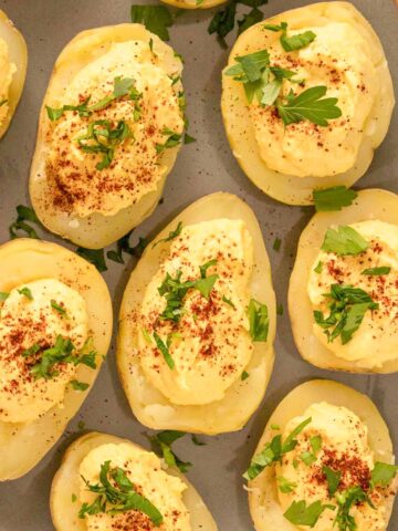 serving tray of deviled potatoes topped with paprika and parsley