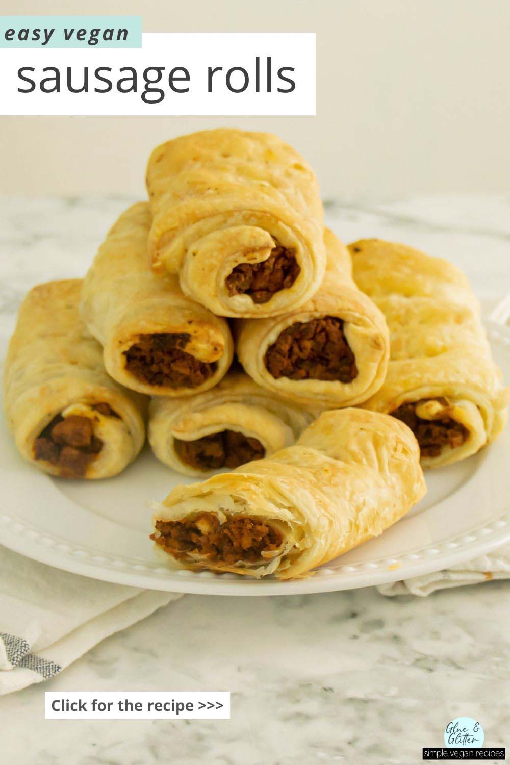 vegan sausage rolls on a white plate, text overlay