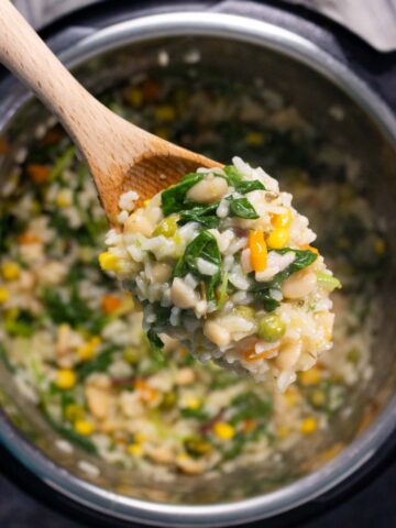 wooden spoon serving Instant Pot vegan risotto