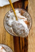 close-up of a spoonful of chai chia pudding resting on a glass