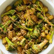 roasted potatoes and broccoli with tahini miso dressing drizzled generously on top