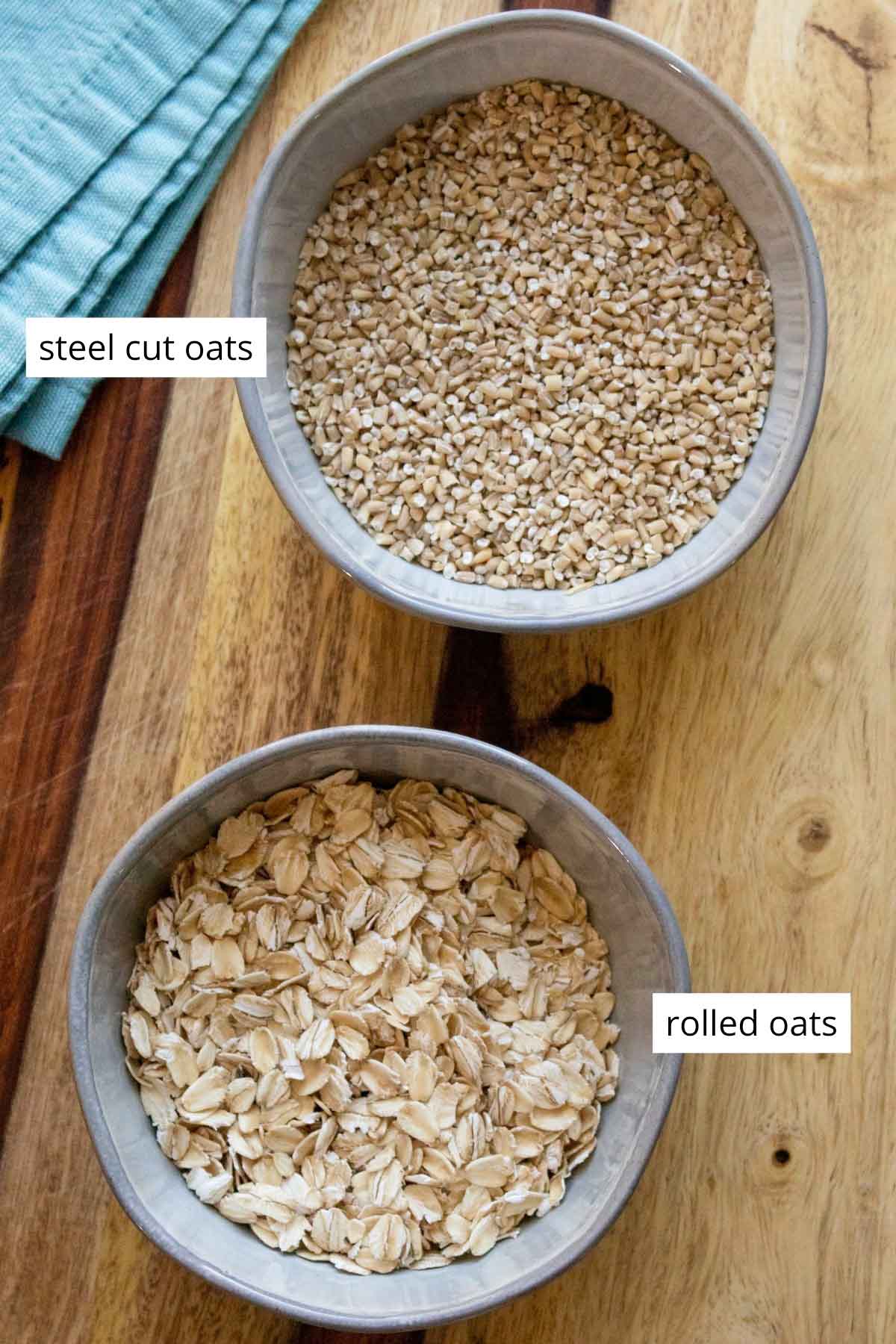 bowls of uncooked steel cut oats and rolled oats with text labels