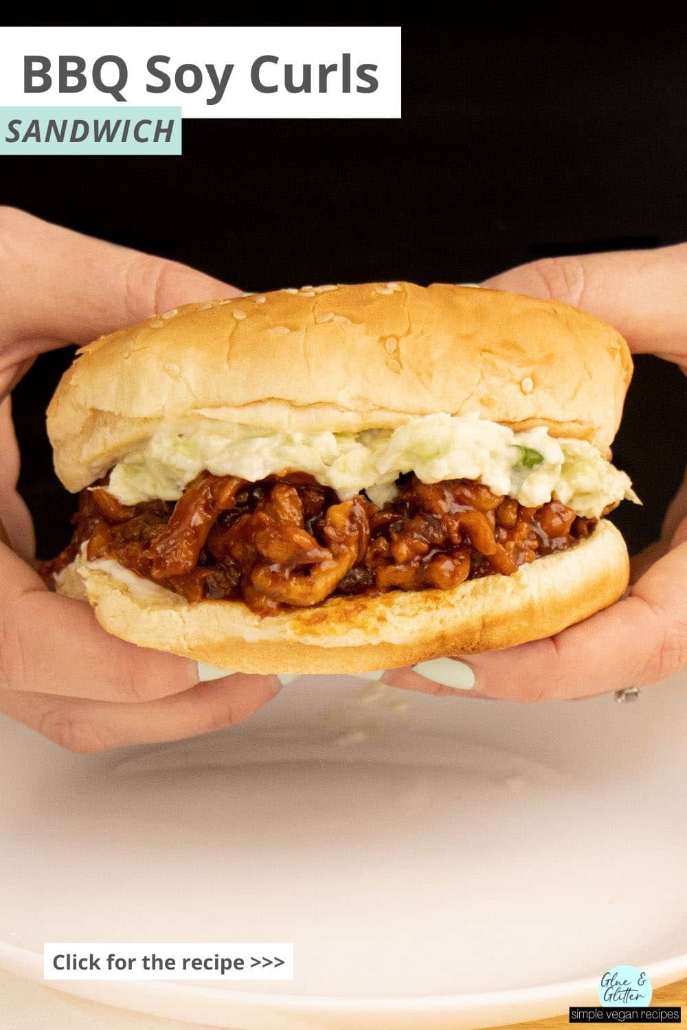 hands holding a BBQ soy curls sandwich, text overlay