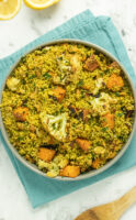 serving bowl of curried couscous salad with roasted vegetables