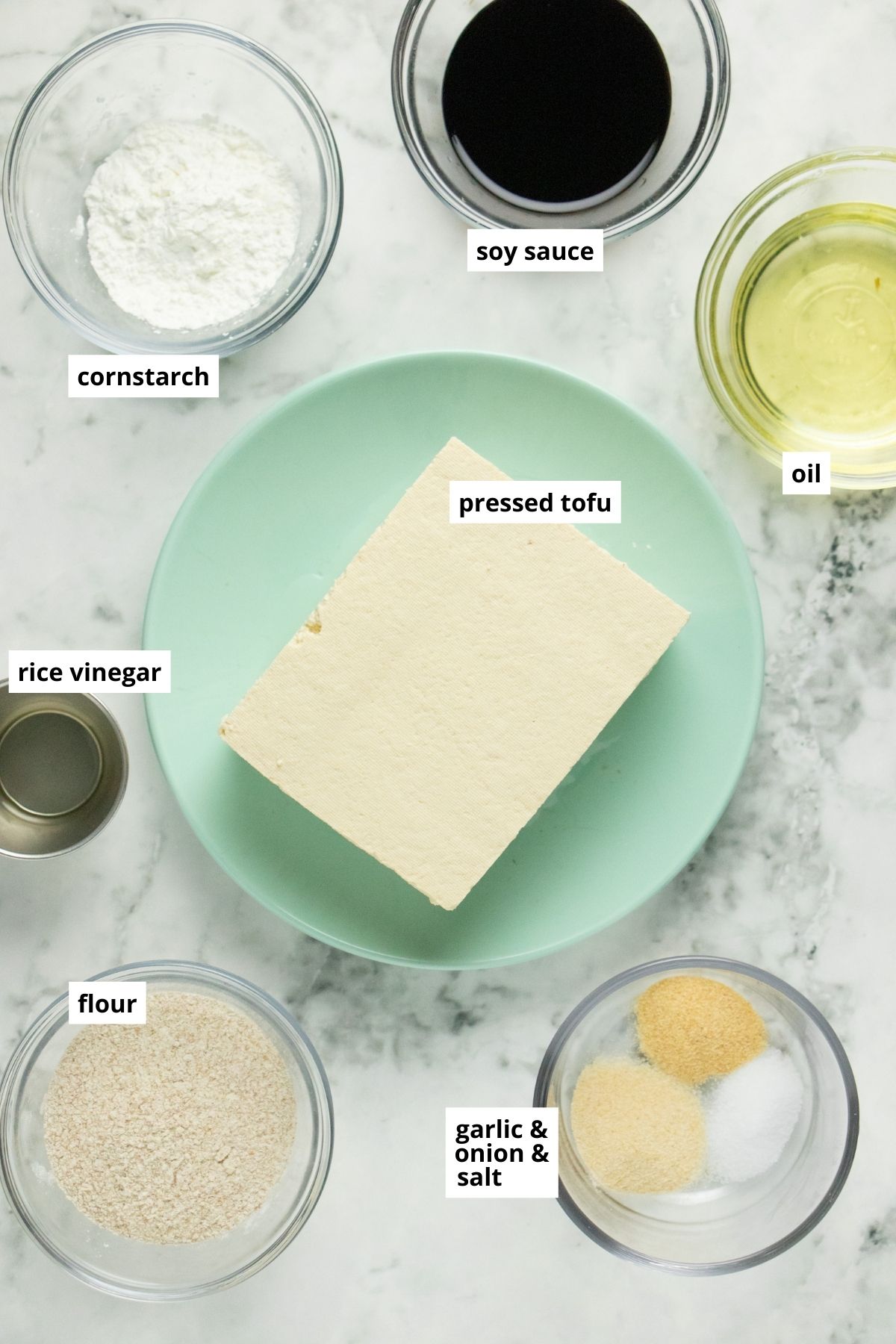 tofu, flour, cornstarch, and other fried tofu ingredients on a white table