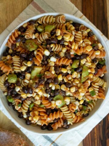 southwest pasta salad in a serving bowl on a wooden table
