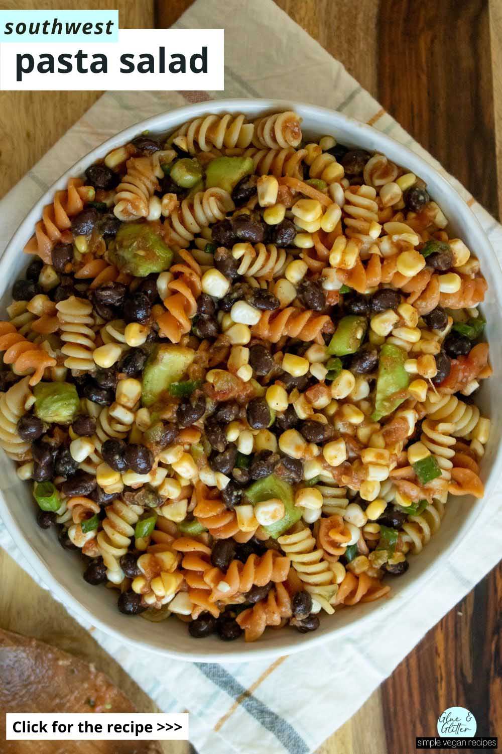 southwest pasta salad in a serving bowl on a wooden table, text overlay