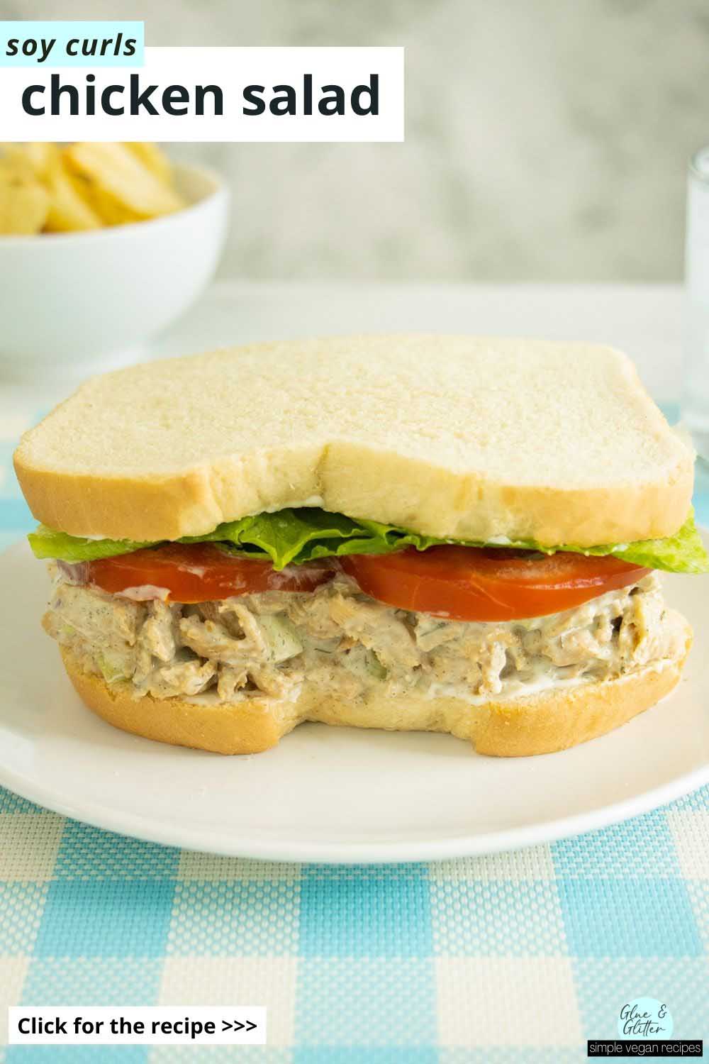 vegan chicken salad sandwich on a white plate, text overlay