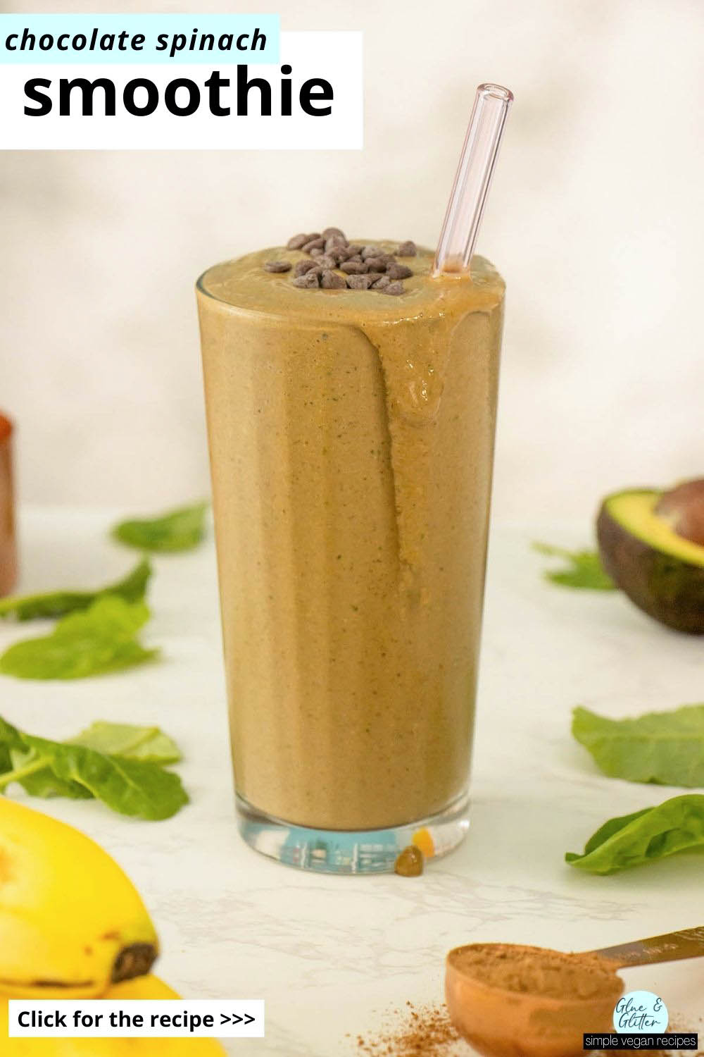 chocolate spinach smoothie on a white table surrounded by the ingredients, text overlay