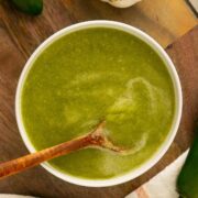 fresh pepper hot sauce in a bowl with a spoon for serving