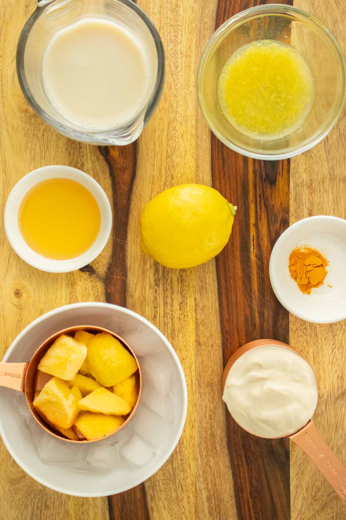 lemonade smoothie ingredients on a wooden cutting board
